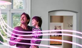 Family look up at lightbulb - Energy Explained