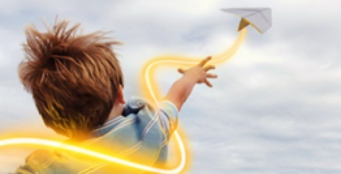 Child throwing paper airplane with glowines
