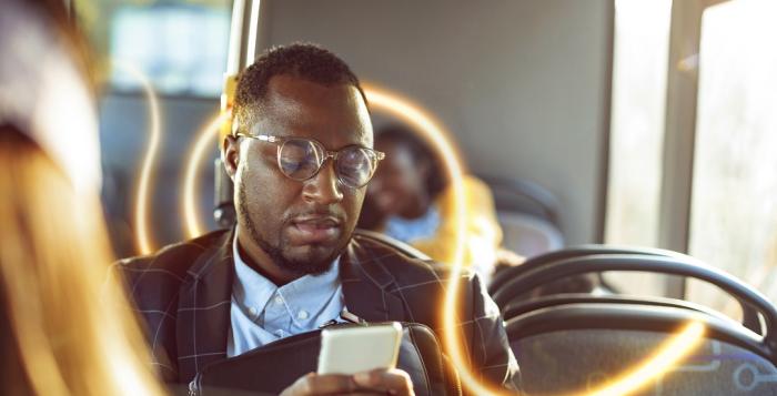 NGESO man on bus reads phone