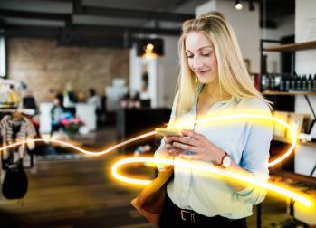 Woman looking at phone with glowlines