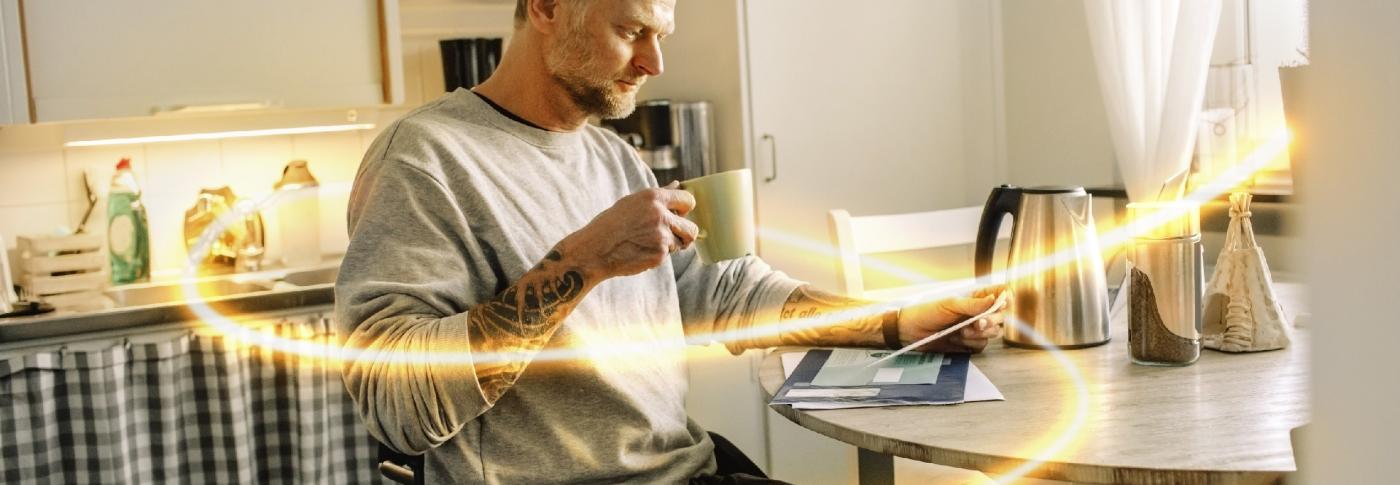 Man reading mail in kitchen with glowlines
