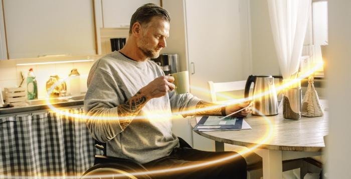 Man reading mail in kitchen with glowlines