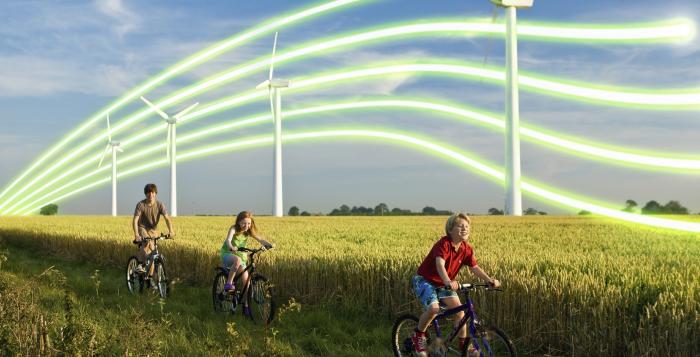 NGESO_Children cycling past wind turbines_Getty-82463488.jpg