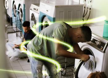 Man using washing machine